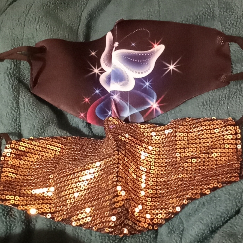 1 sequined gold mask and 1 butterfly mask.